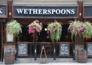 Wetherspoon shares slide as soaring labour and energy costs hit profits